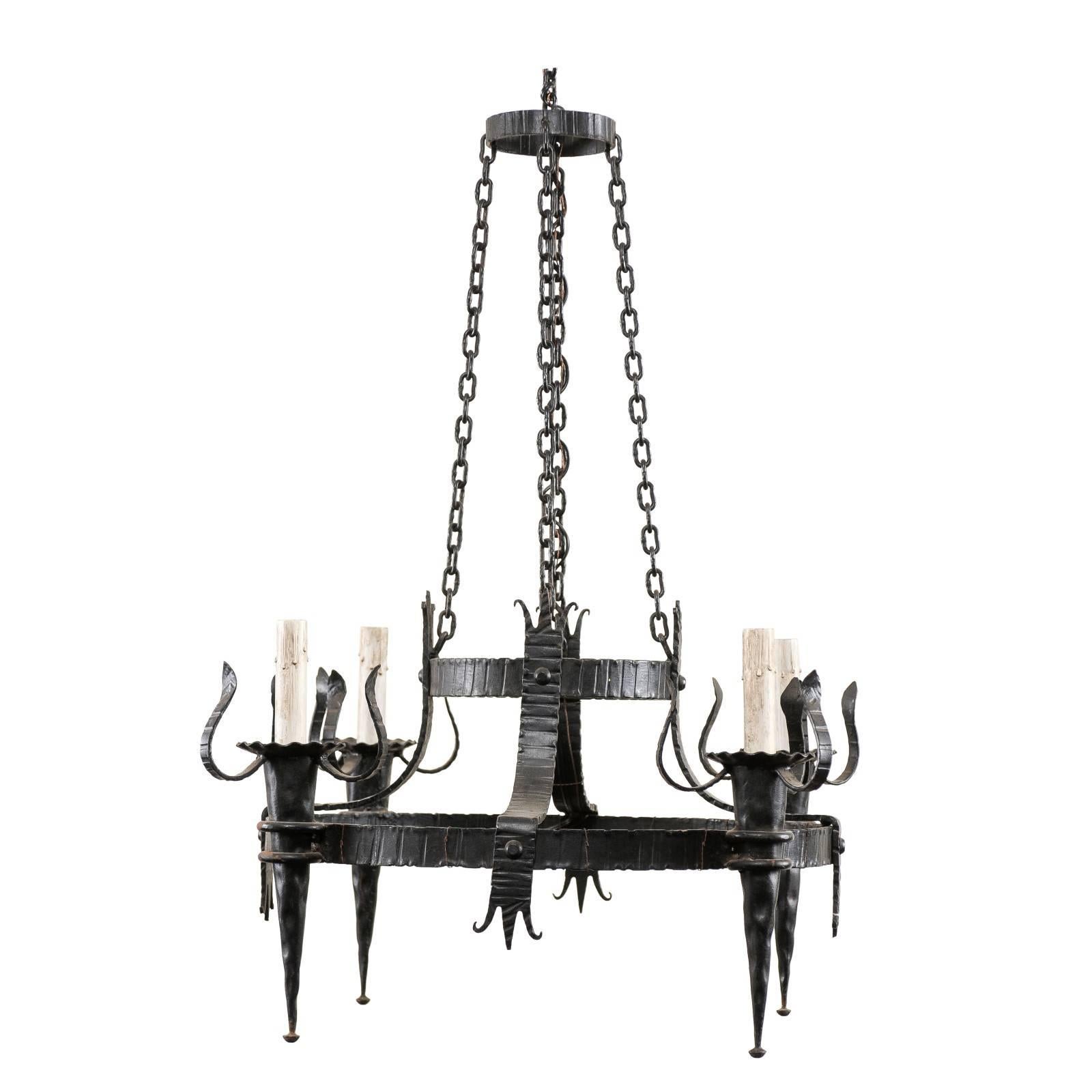 French Vintage Four-Light Black Iron Chandelier with Torch Shaped Arms For Sale