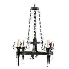 French Vintage Four-Light Black Iron Chandelier with Torch Shaped Arms