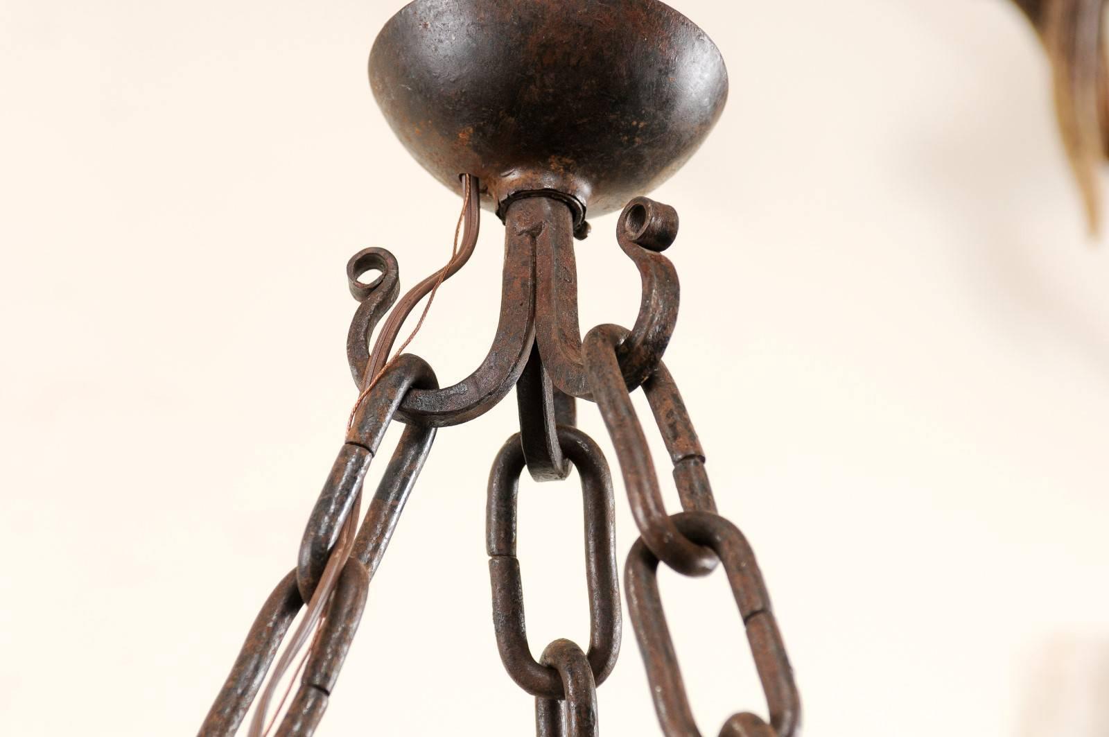 Vintage Round Iron Chandelier with Eight Torch Style Lights and Scroll Pattern In Good Condition In Atlanta, GA