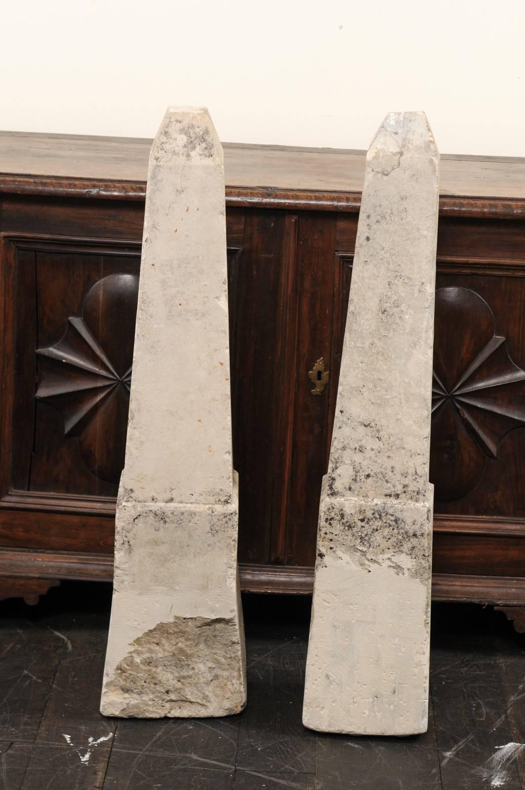 Pair of 19th century French stone obelisks, property markers. This pair of antique French property markers have each been hand cut from a single piece of limestone and have exquisite obelisk shapes. They have wonderful age and patina throughout,