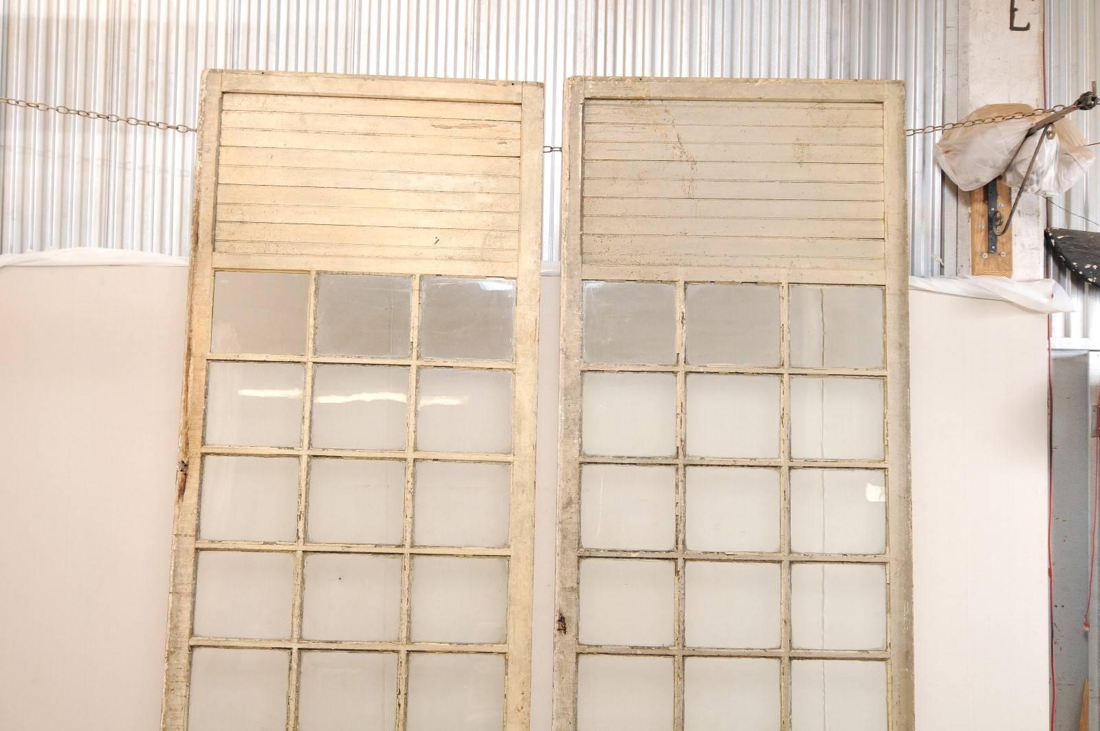 10 ft+ Tall French Pair of Glass Paneled Wood Doors from the Early 20th C. For Sale 1