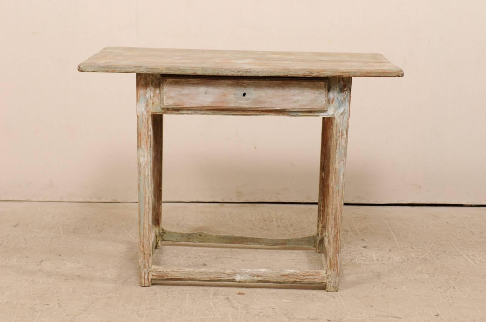 A period Gustavian Swedish fir wood side table. This Swedish table from the early 19th century features, simple, clean lines, an over-hung and rectangular-shaped top, and single drawer. This table is raised on four squared legs, and supported with