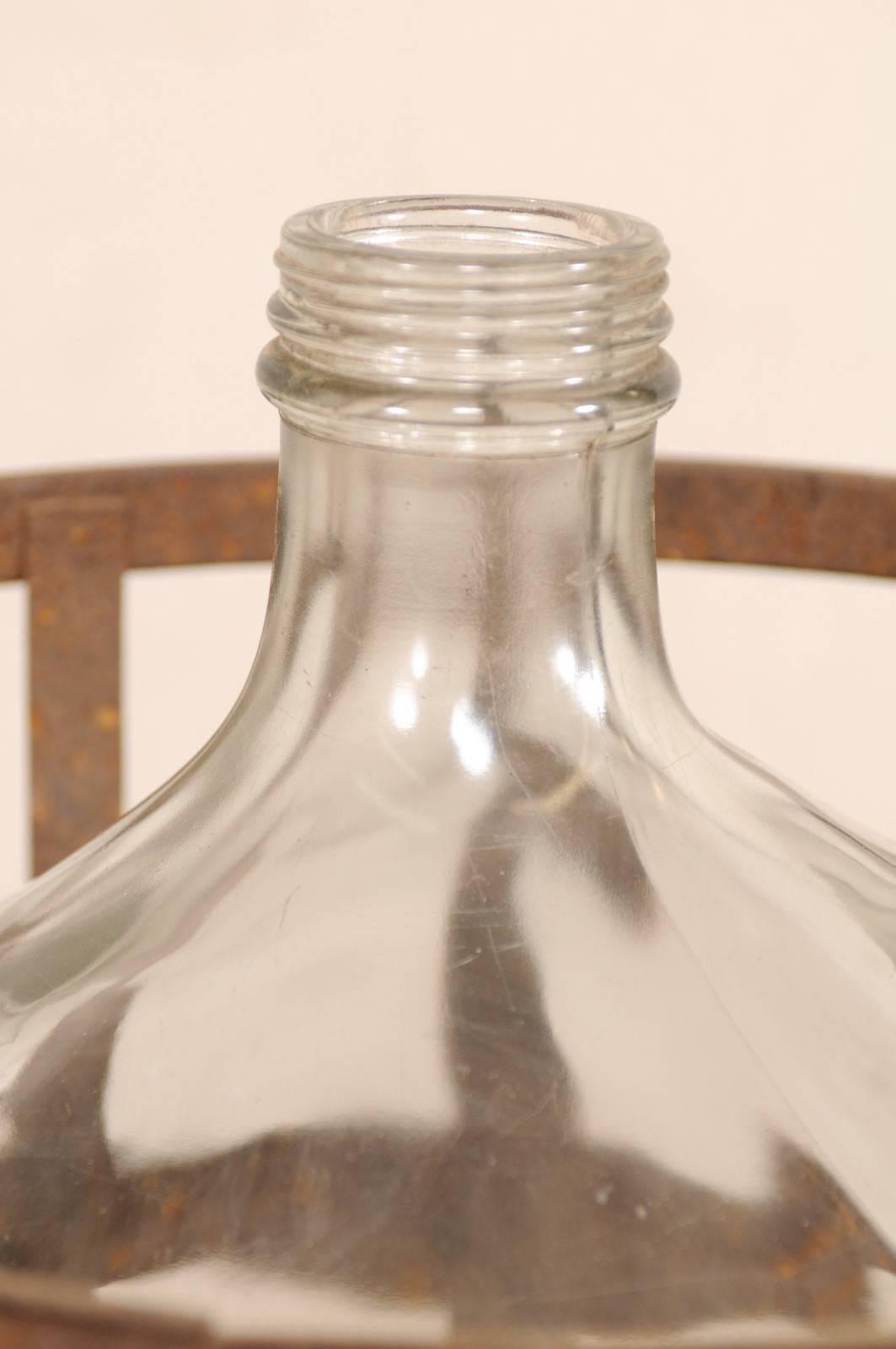 Pair of French Mid-20th Century Vintner Iron Baskets with Demijohn Wine Bottles In Good Condition In Atlanta, GA