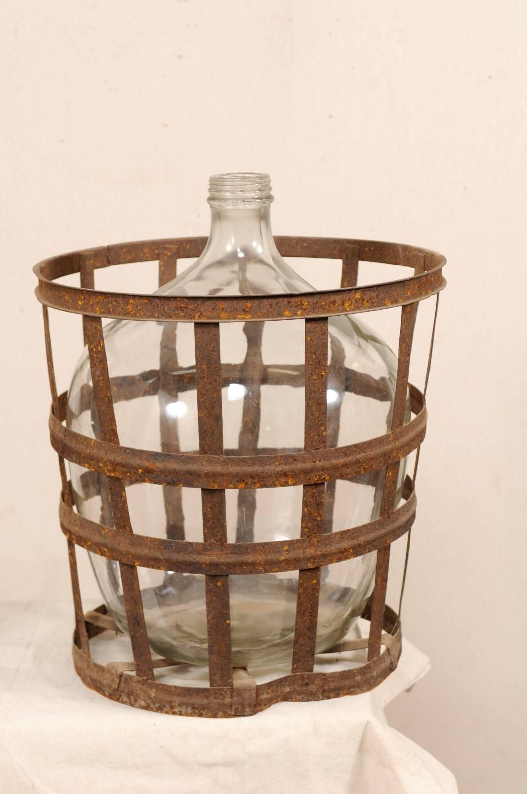 Pair of French Mid-20th Century Vintner Iron Baskets with Demijohn Wine Bottles 1