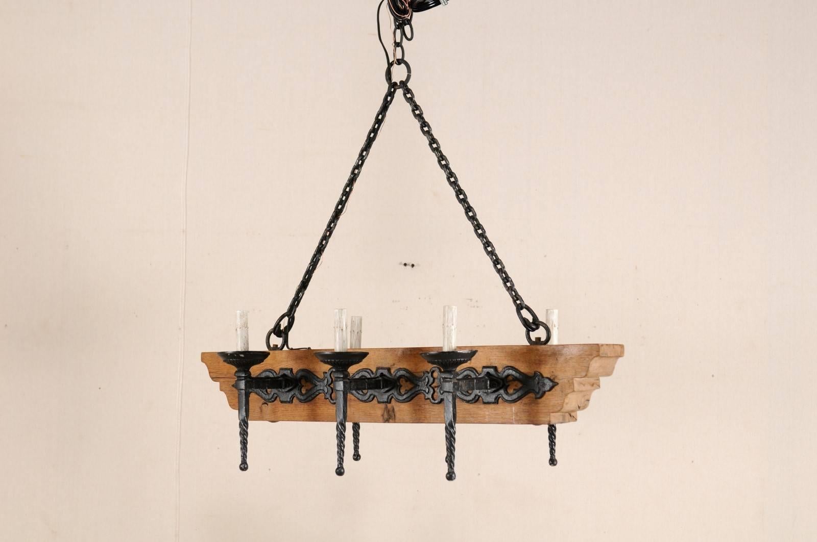 French Vintage Six-Light Wood and Ornate Iron Chandelier with Torch Style Arms In Good Condition For Sale In Atlanta, GA