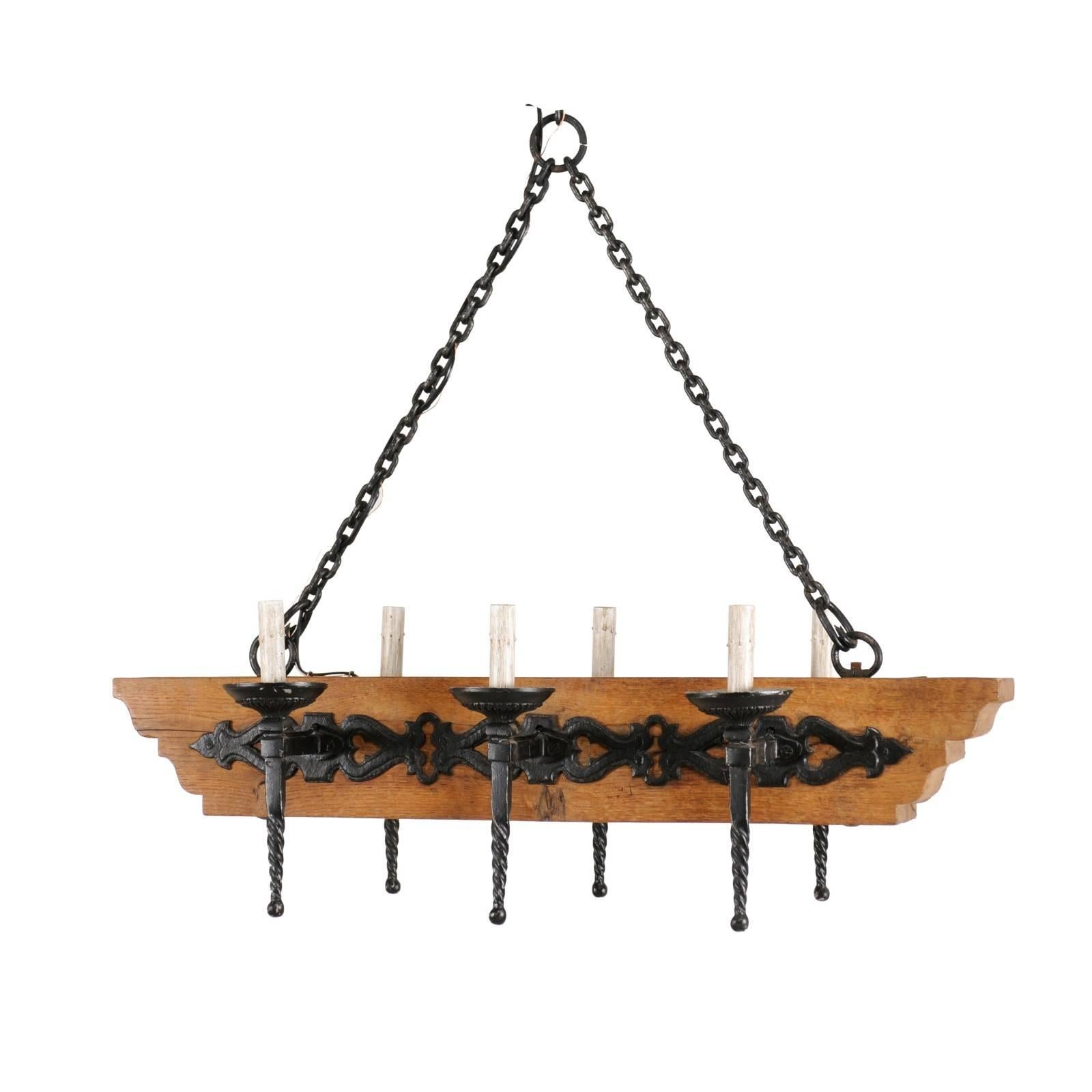 French Vintage Six-Light Wood and Ornate Iron Chandelier with Torch Style Arms