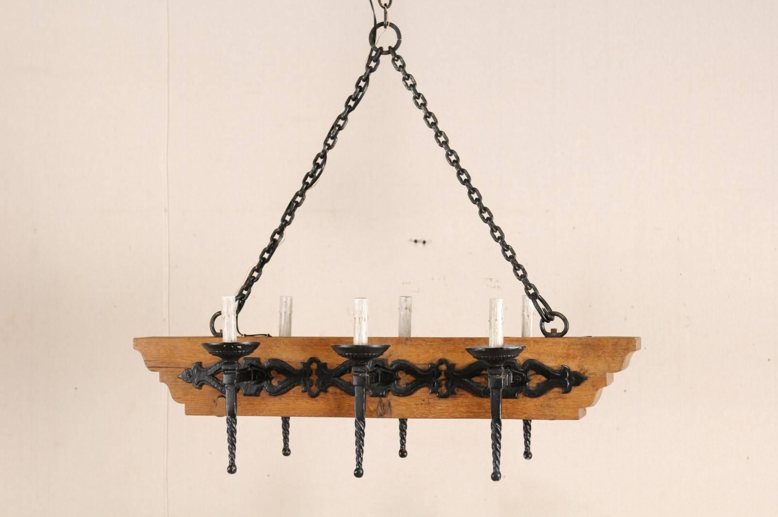 French Vintage Six-Light Wood and Ornate Iron Chandelier with Torch Style Arms For Sale 5