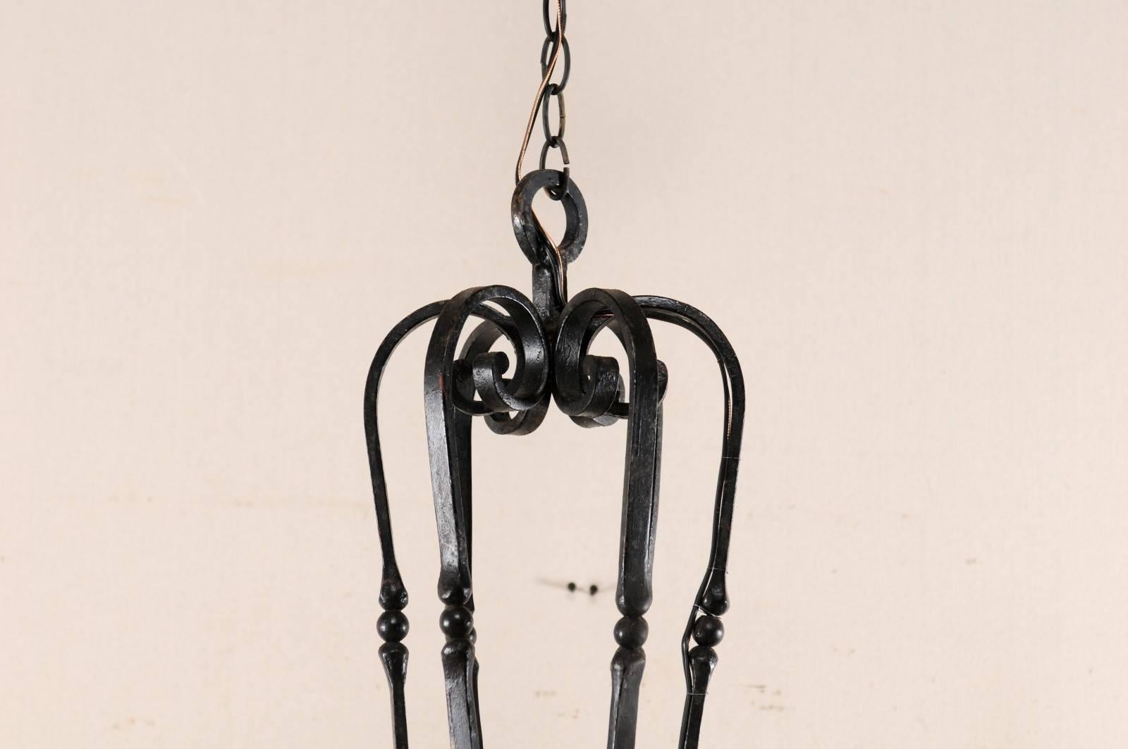20th Century An Elegant French Six Light Scrolling Black Forged-Iron Chandelier, Rewired For Sale