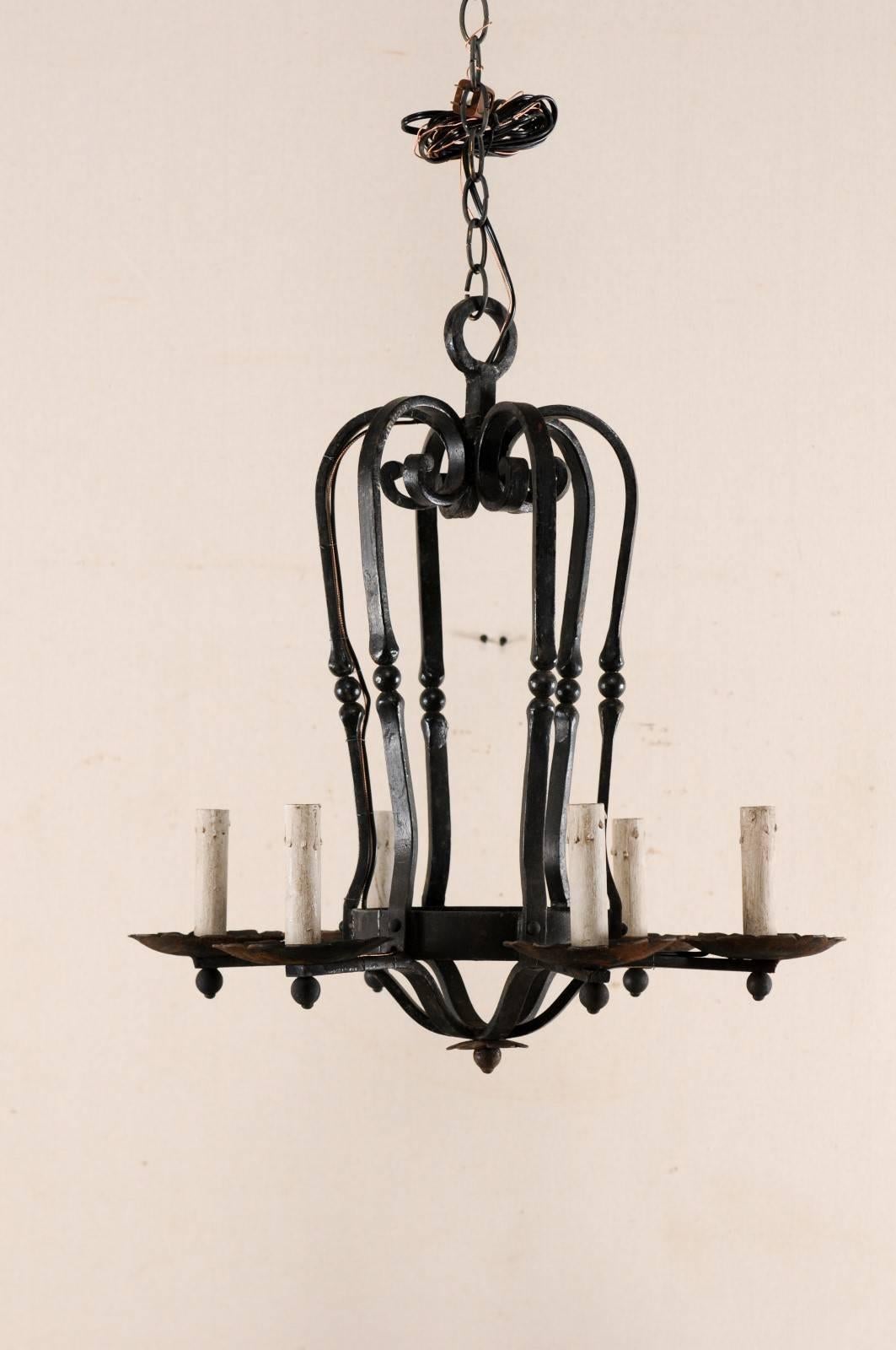 Patinated An Elegant French Six Light Scrolling Black Forged-Iron Chandelier, Rewired For Sale