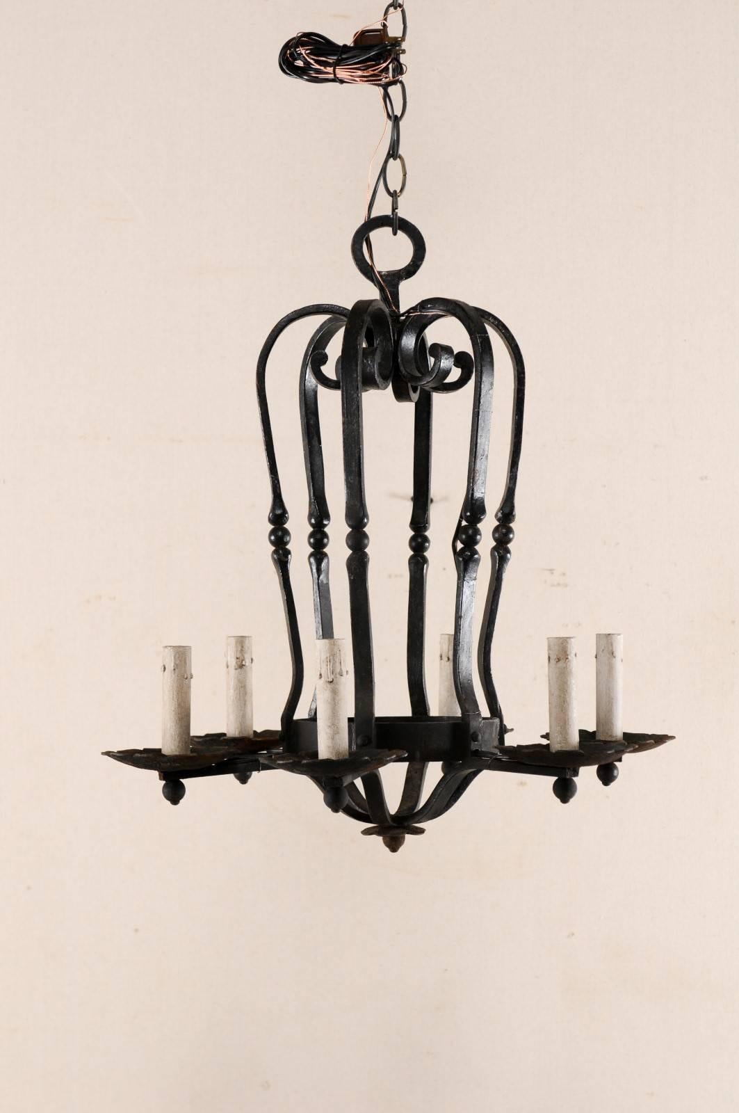 An Elegant French Six Light Scrolling Black Forged-Iron Chandelier, Rewired In Good Condition For Sale In Atlanta, GA