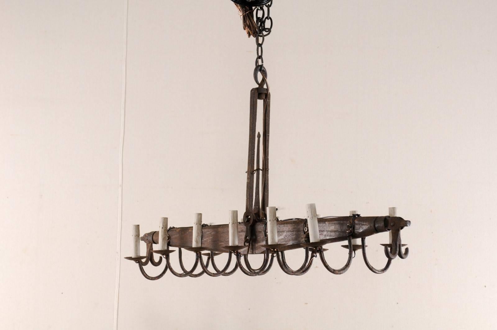 Patinated French Linear 12-Light Iron Chandelier with Swag Arms, Mid 20th Century  For Sale