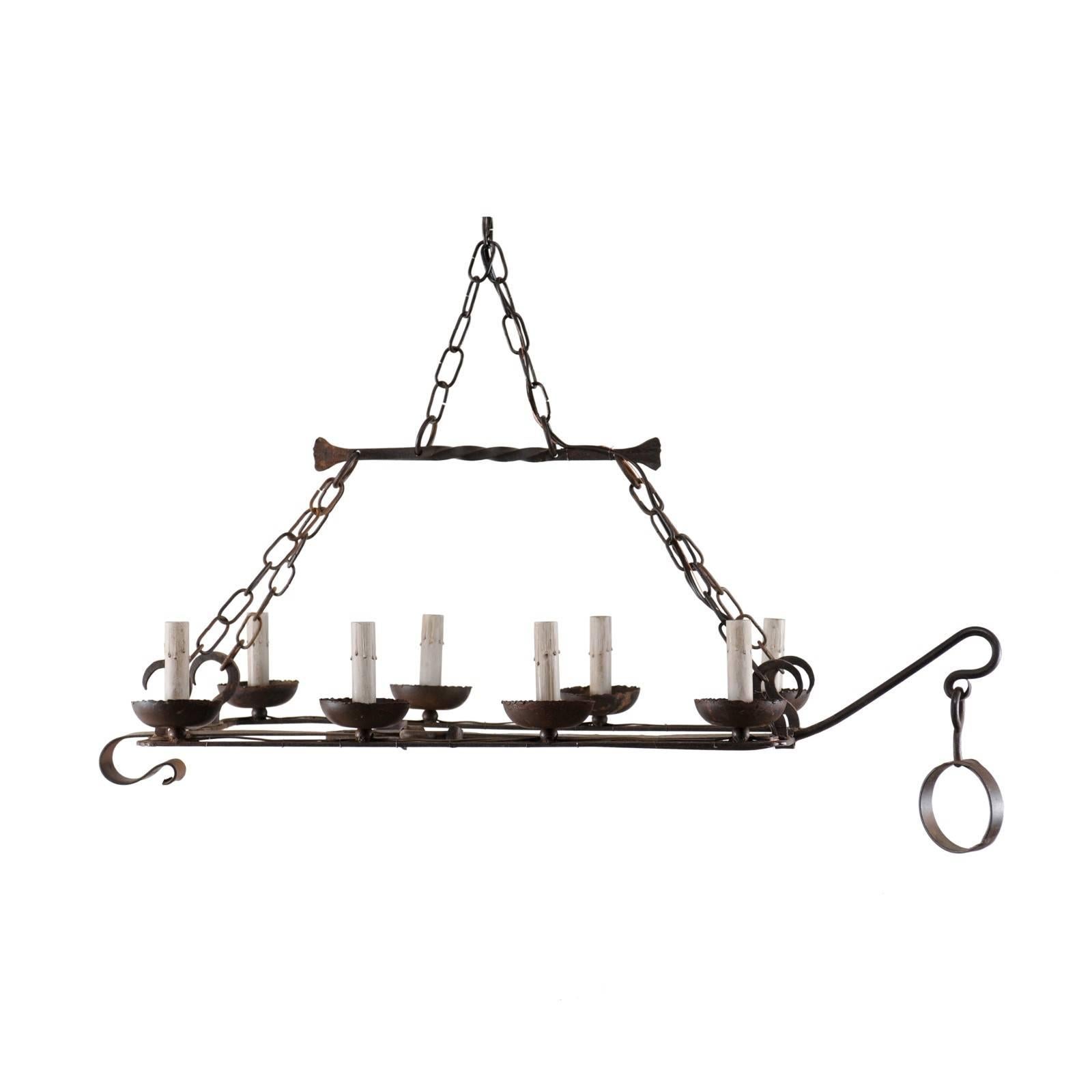 French Mid-20th Century Eight-Light Forged Iron Chandelier Made from a Spit-Jack
