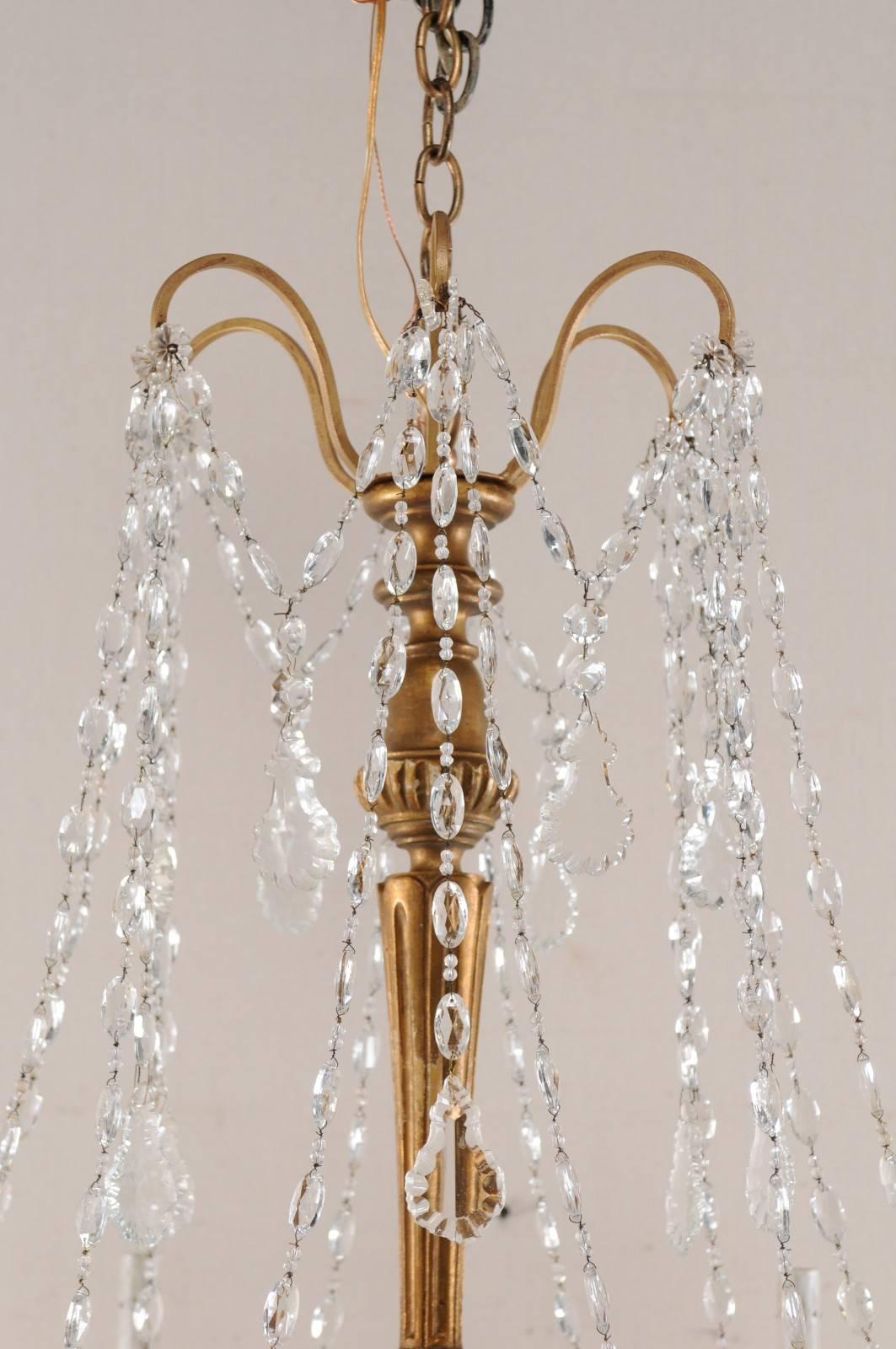 Italian Basket Shaped Elegant Crystal Chandelier with Carved and Gilded Column In Good Condition In Atlanta, GA