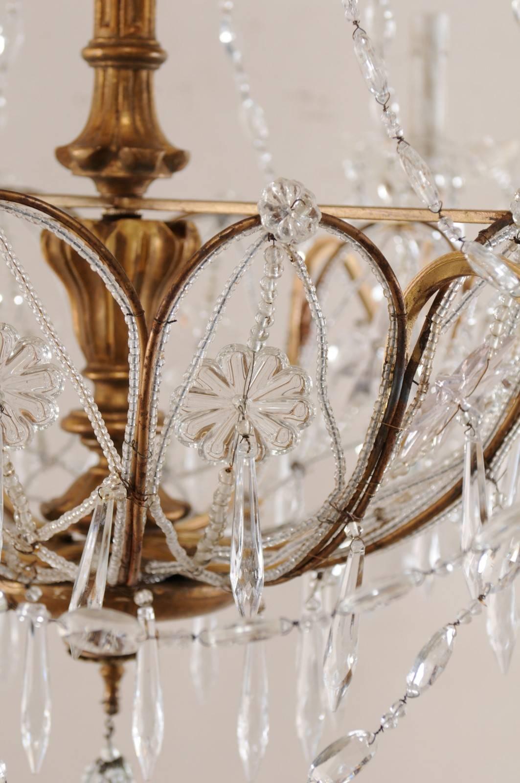 Wood Italian Basket Shaped Elegant Crystal Chandelier with Carved and Gilded Column