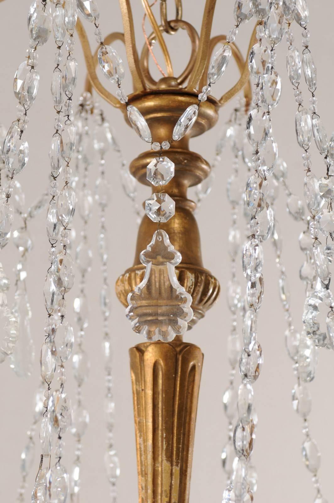 20th Century Italian Basket Shaped Elegant Crystal Chandelier with Carved and Gilded Column