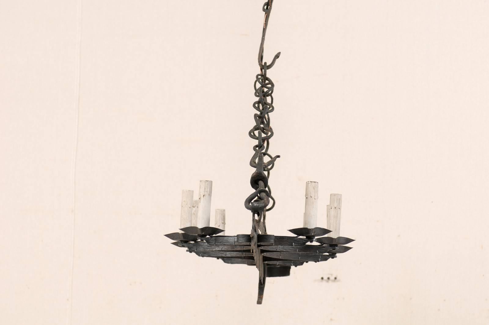 Metal French Eight-Light Forged Iron Chandelier Made from a 19th Century Spit-Jack For Sale