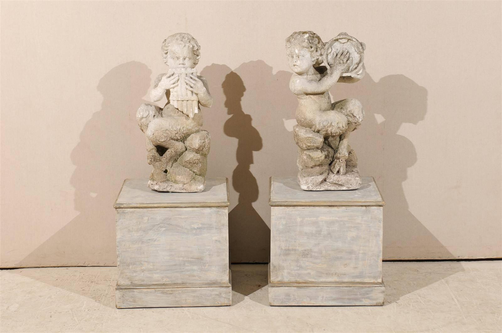 A pair of Italian early 20th century carved limestone 
