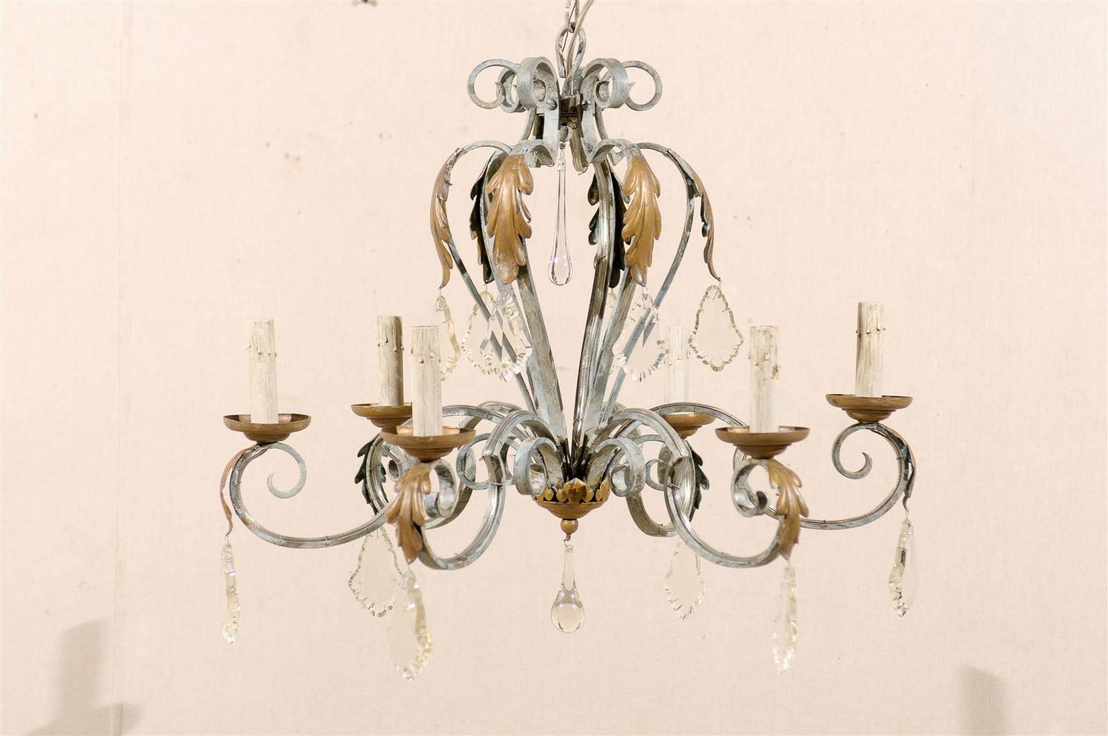A French vintage six-light painted iron and crystal chandelier with scrolled arms and acanthus leaves from the mid-20th century.

Rewired for the US, this chandelier comes with a complimentary 3 foot chain and canopy painted to match.