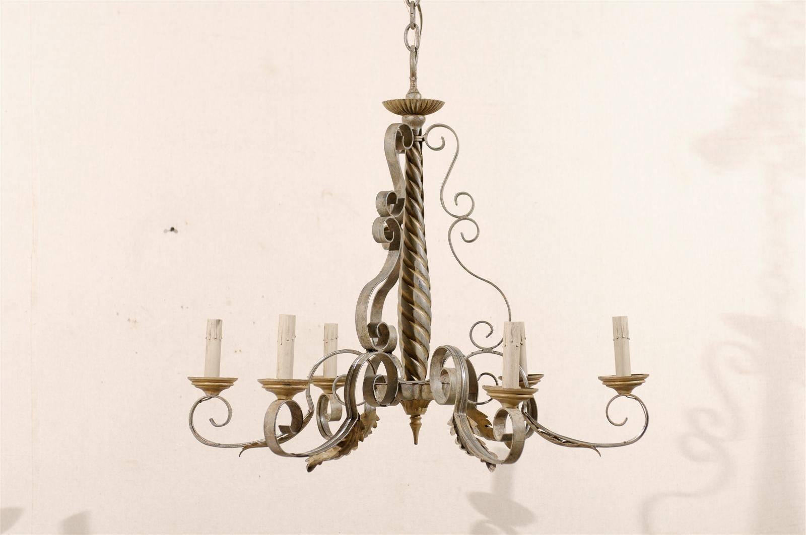 A French six-light vintage painted metal and wood chandelier with S-scroll arms, acanthus leaves along the arms and twisted central column from the mid-20th century.

This vintage French chandelier has been rewired for the US market and comes with