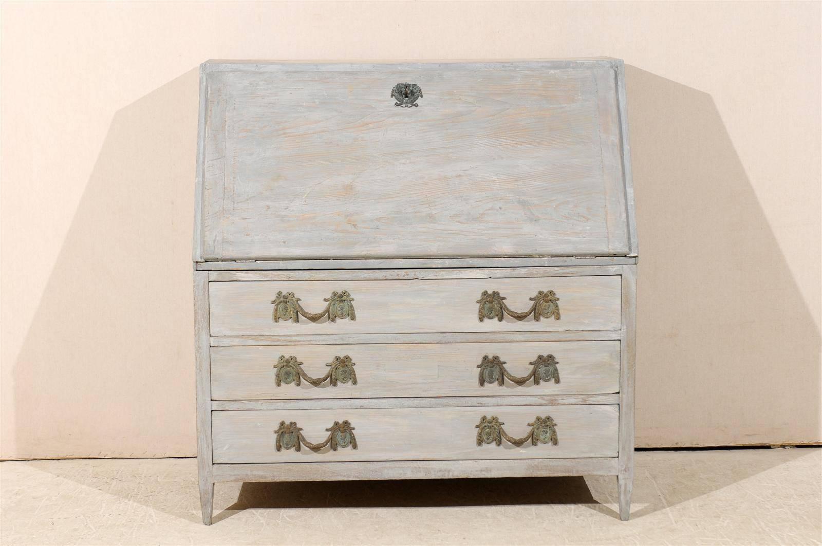 A Swedish mid-19th century painted wood Gustavian style slant-front desk or secretary with three lower drawers standing on short tapered feet.

Here are the measurements: 48