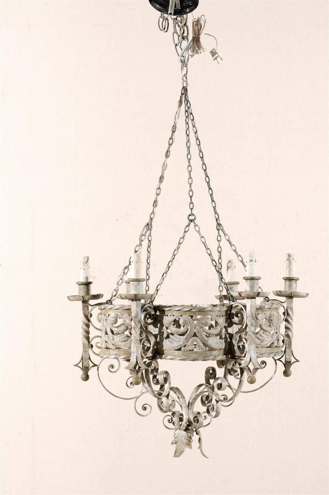 An Italian painted iron six-light circular chandelier with beautiful pierced details on the ring and twisted arms from the mid-20th century.

This painted iron chandelier has been rewired for the US and comes with a complimentary three foot chain