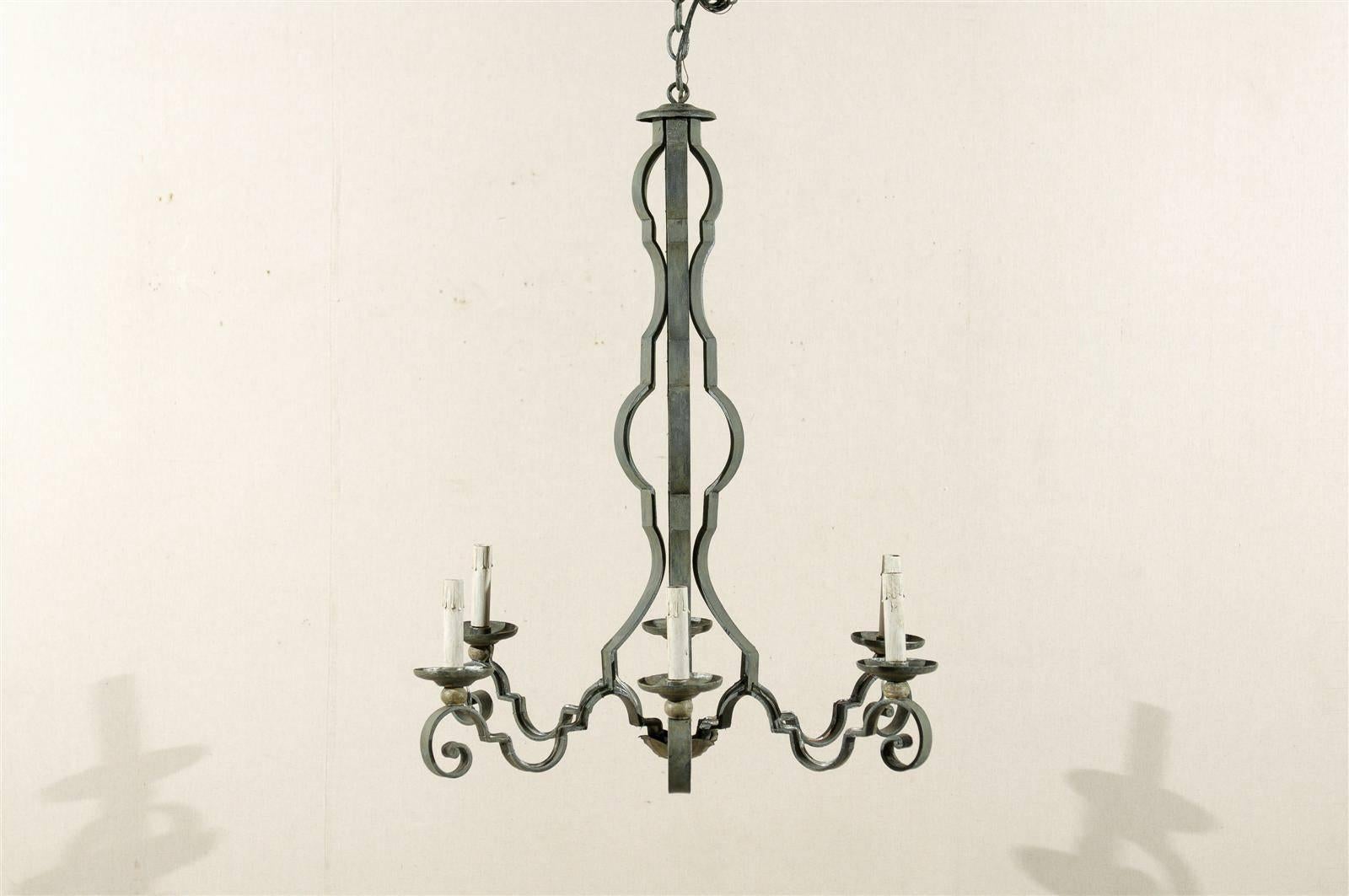 A French mid-20th century painted iron six-light chandelier with scroll arms.

This French painted iron chandelier has been rewired for the US and comes with a complimentary 3 foot chain and canopy painted to match.
 
