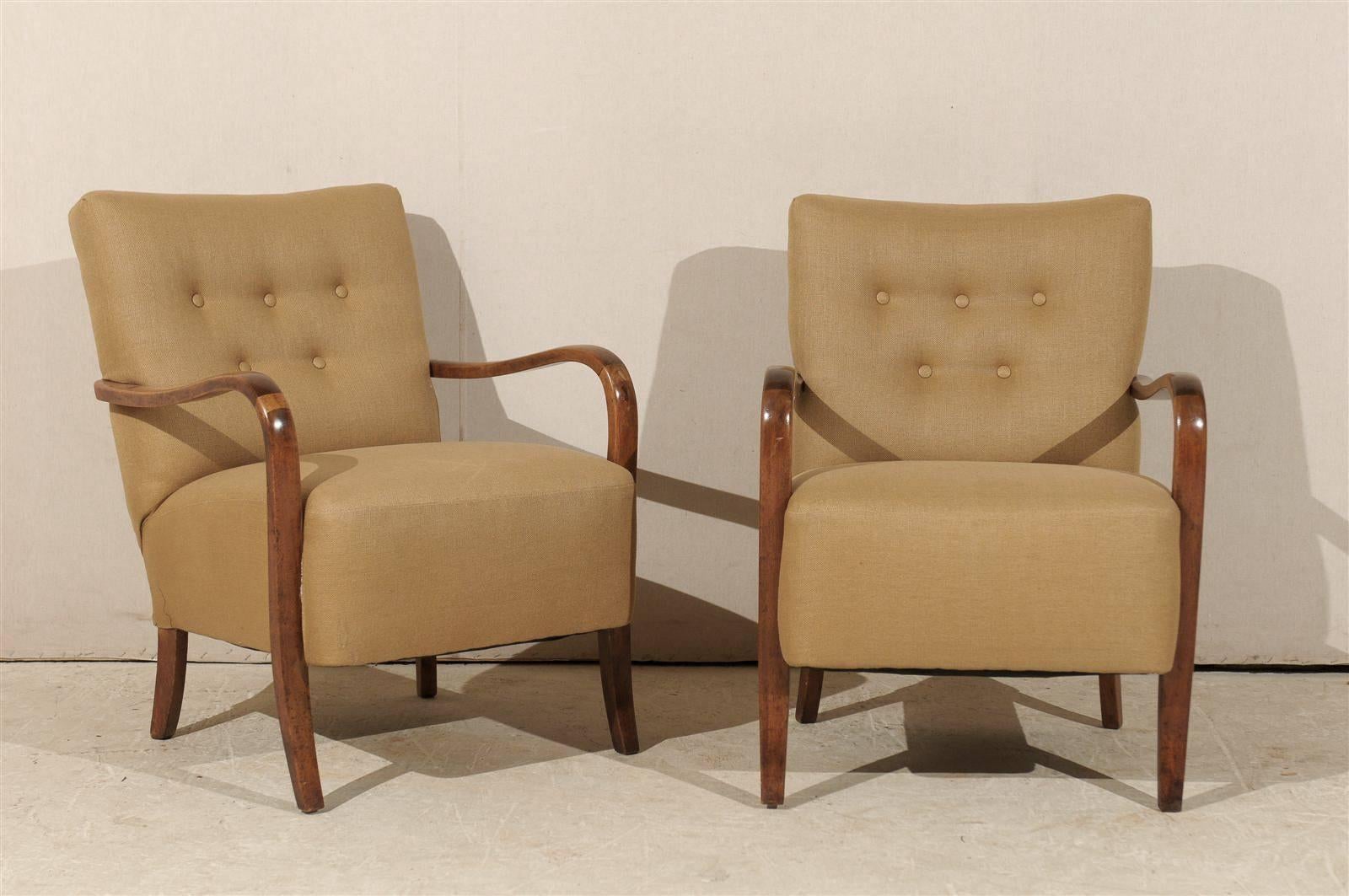 Pair of Swedish Art Deco upholstered wooden armchairs from the mid-20th century.