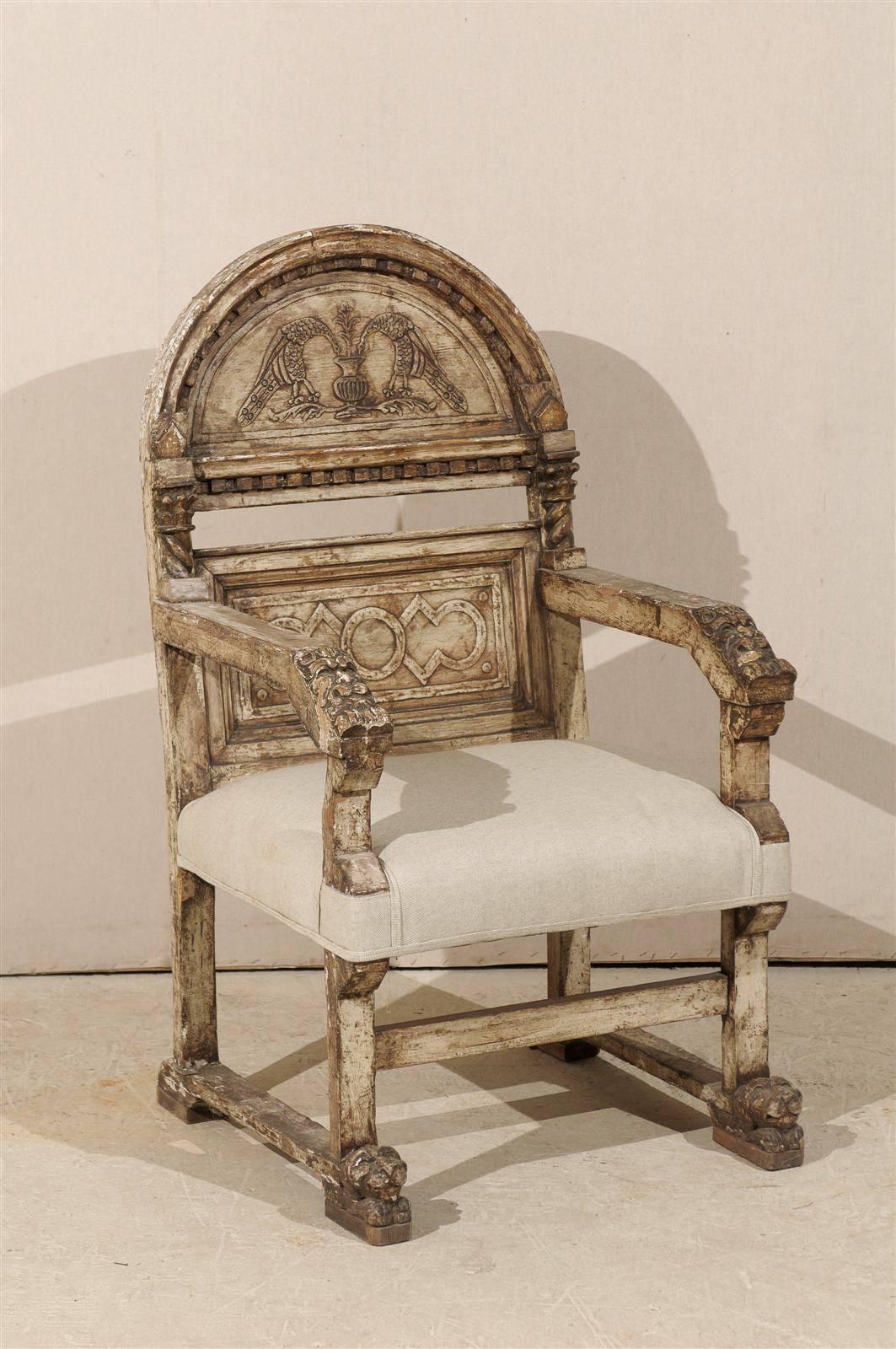 An Italian early 19th century richly decorated single wooden chair with animal feet, stretcher and semi-circular back ornate with birds drinking from an urn carving.  The back rest also features intricate dentil molding details.  A pair of