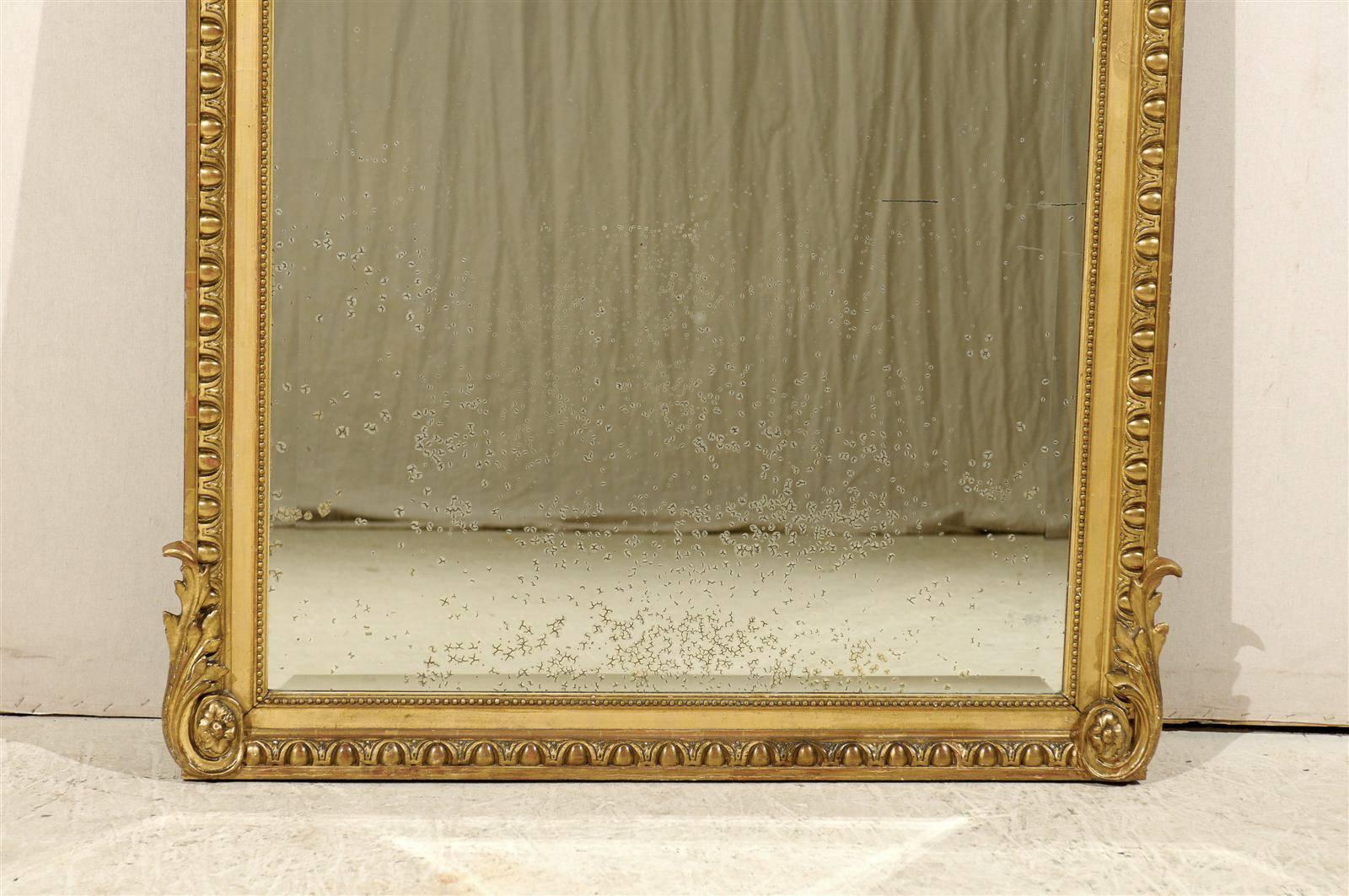 A French Antique Beautifully Carved & Gilt Mirror, Standing over 5.5 Ft Tall In Good Condition For Sale In Atlanta, GA