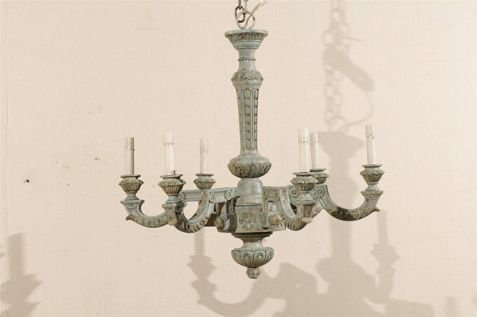 A French vintage six-light blue / grey painted and carved wood chandelier with interesting arm shapes, flower and circle motifs from the mid-20th century.

This French wooden chandelier has been rewired for the US and comes with a complimentary 3