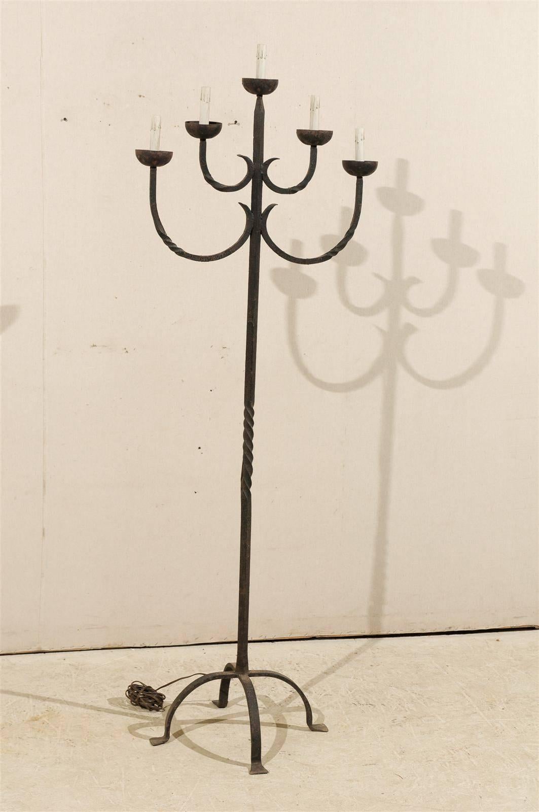 A French Five-Light Wrought Iron Floor Lamp on Quadripod Base from the mid-20th Century.

This wrought iron floor lamp has been rewired for the US.

.