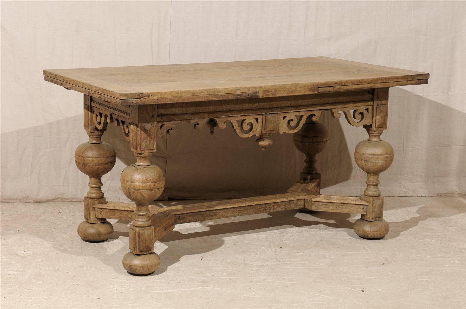 An exquisite Swedish early 19th century Baroque style wooden table / desk.

With its richly carved apron featuring volute ornaments, natural finish, cross stretcher and turned legs, this Swedish table will make a beautiful statement in your home.