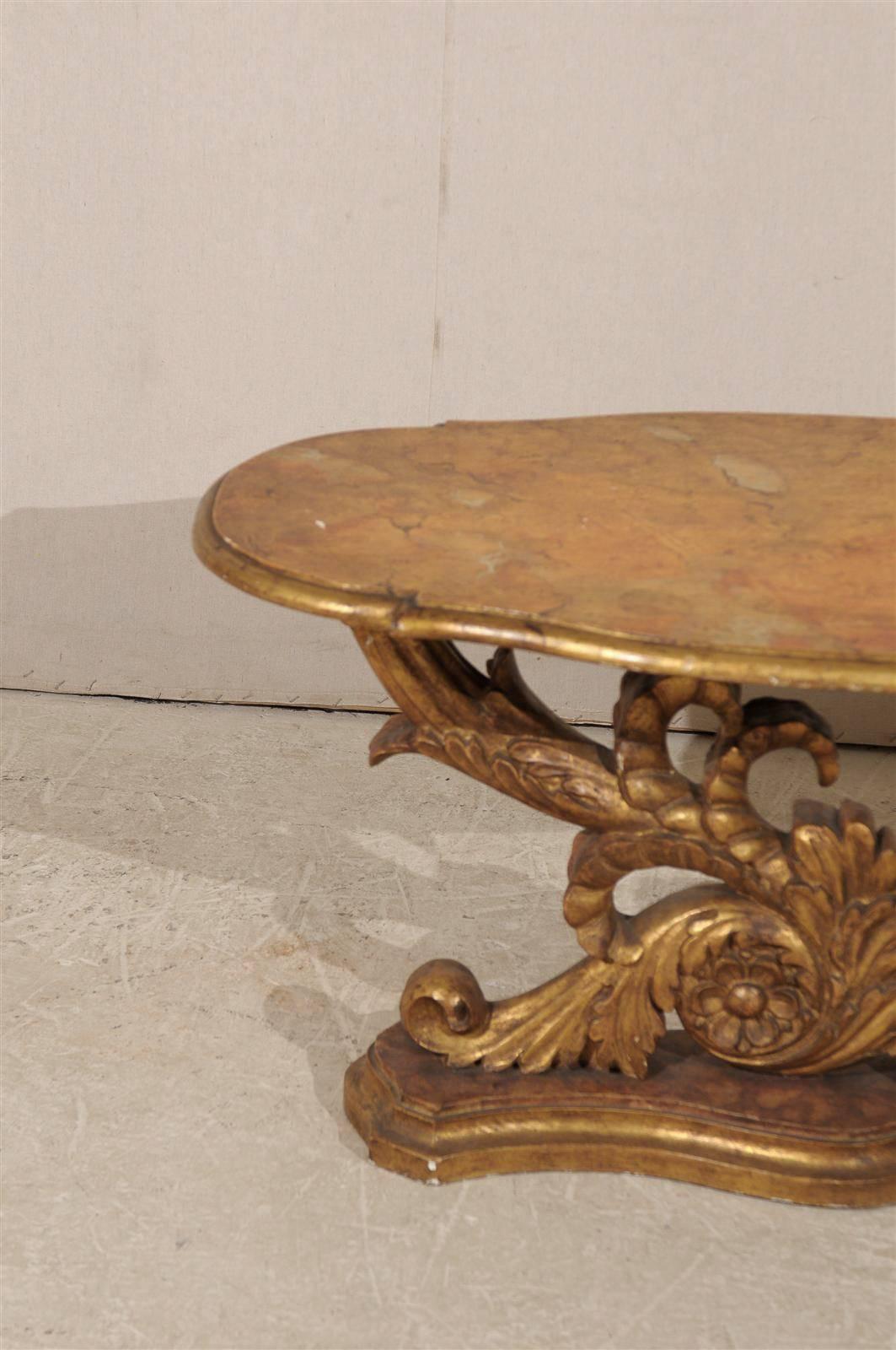 An Italian Mid 19th Century Giltwood Oval Coffee Table with Faux Marble Top In Good Condition For Sale In Atlanta, GA