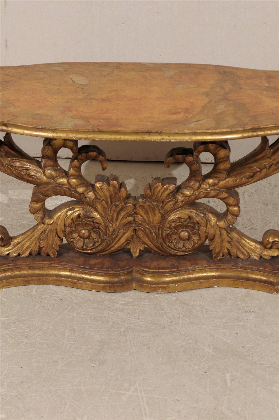 Wood An Italian Mid 19th Century Giltwood Oval Coffee Table with Faux Marble Top For Sale