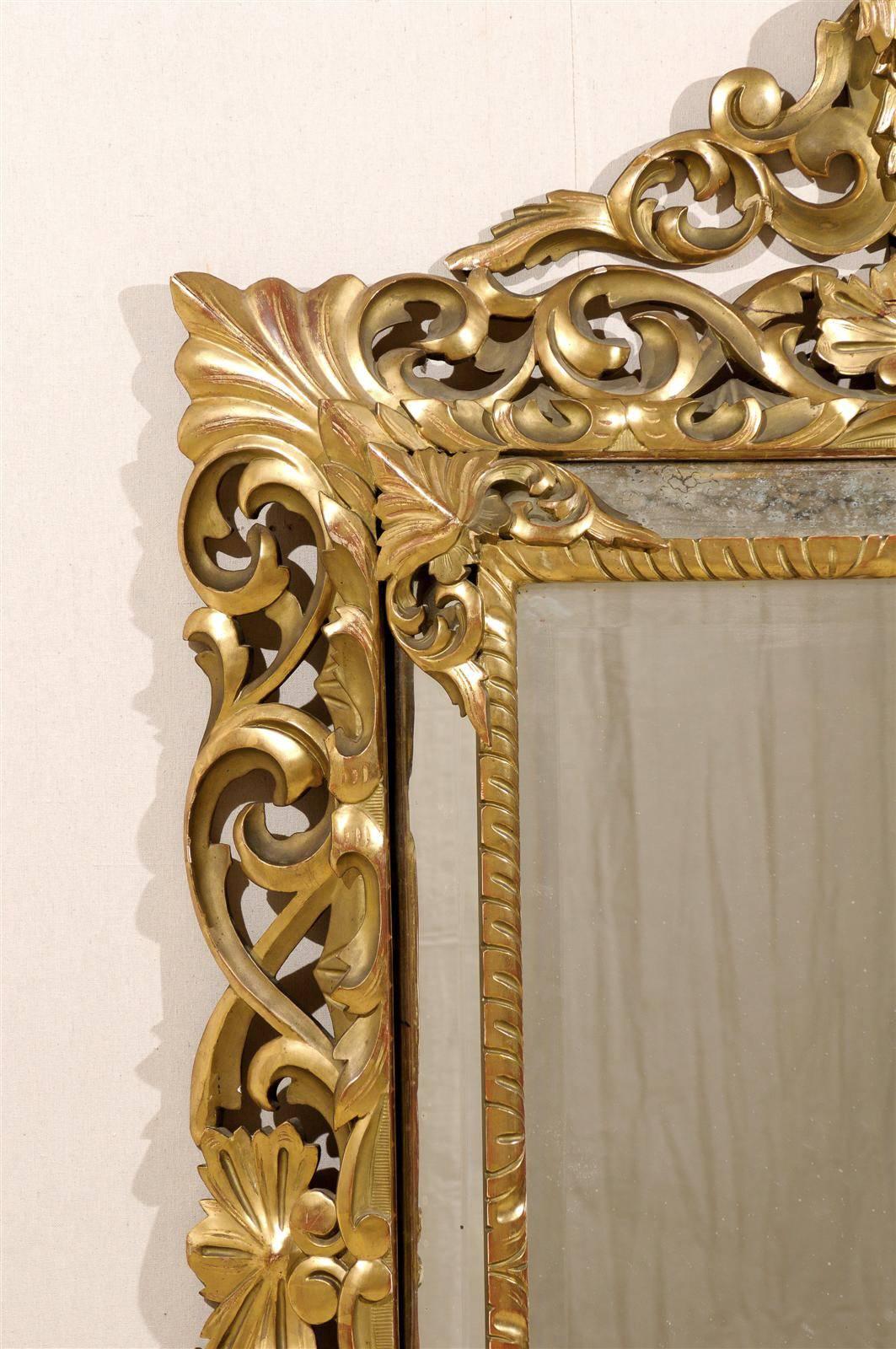 An Italian 19th Century Gilt Wood Mirror with Ornate Foliage Decor, Gold Color In Good Condition For Sale In Atlanta, GA
