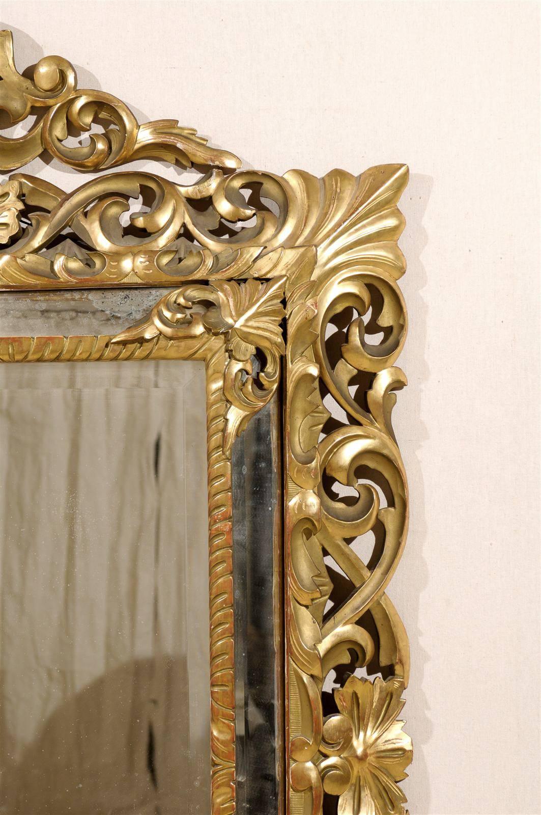 An Italian 19th Century Gilt Wood Mirror with Ornate Foliage Decor, Gold Color For Sale 1