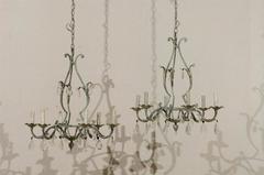 A Pair of French Painted Iron and Crystal Six-Light Chandeliers with Leaf Motifs