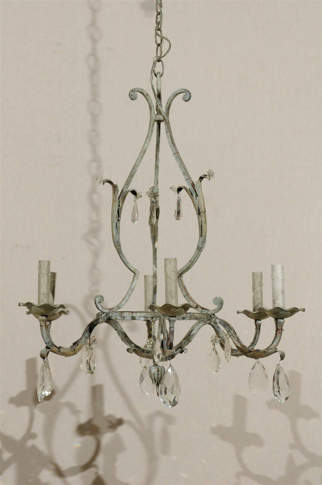 A Pair of French Painted Iron and Crystal Six-Light Chandeliers with Leaf Motifs 1