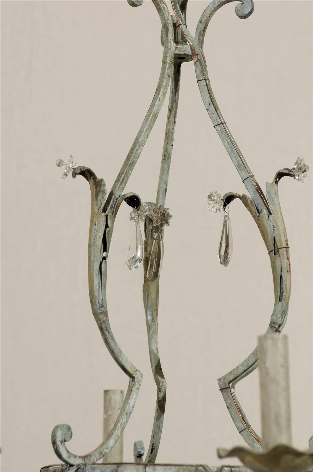 A Pair of French Painted Iron and Crystal Six-Light Chandeliers with Leaf Motifs 4