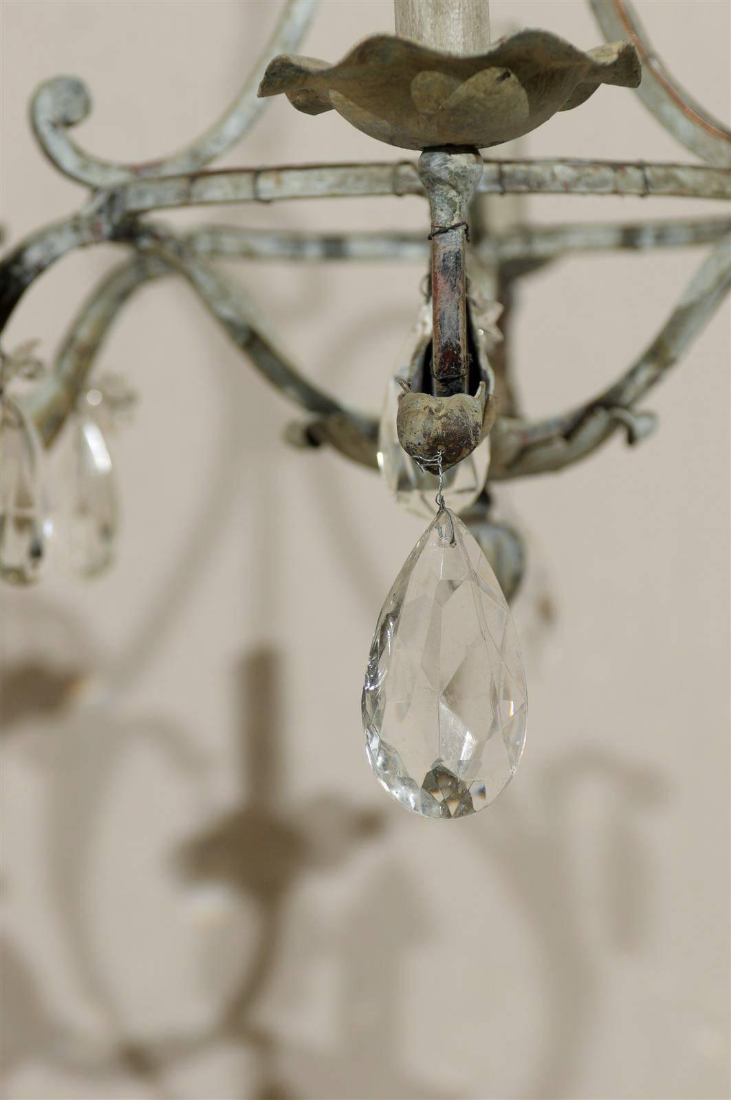 A Pair of French Painted Iron and Crystal Six-Light Chandeliers with Leaf Motifs 5