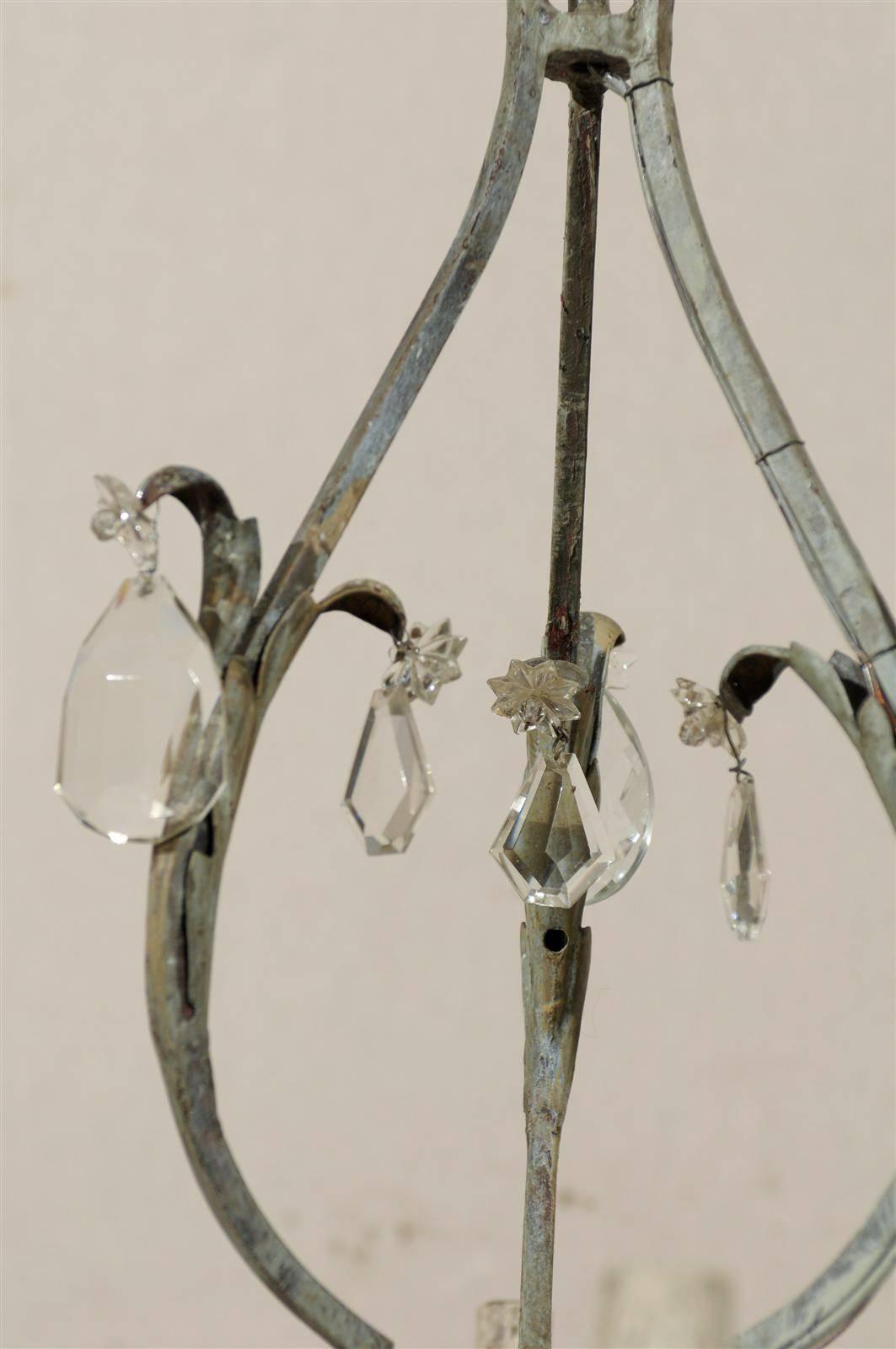 A Pair of French Painted Iron and Crystal Six-Light Chandeliers with Leaf Motifs 6