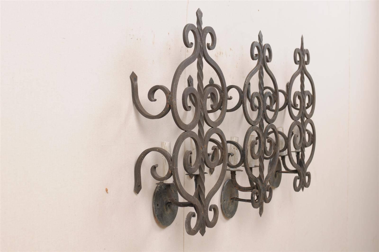 20th Century A Set of Three French Two-Light Forged Iron Sconces Featuring Scroll Decor
