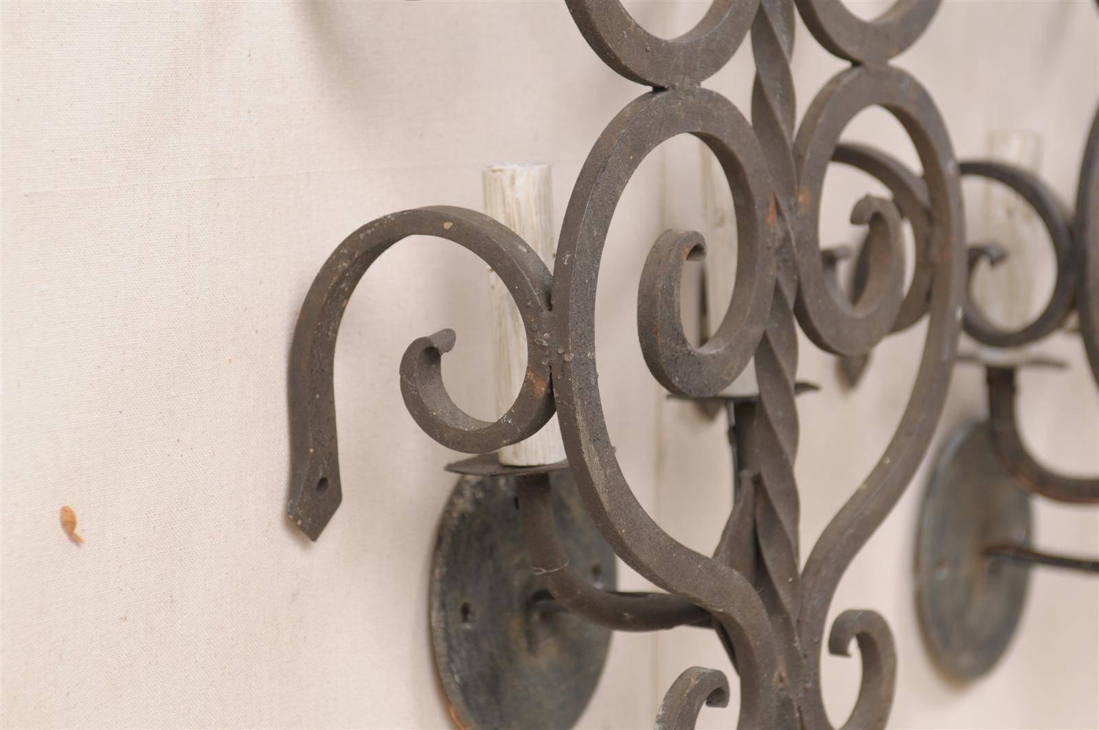 A Set of Three French Two-Light Forged Iron Sconces Featuring Scroll Decor 3