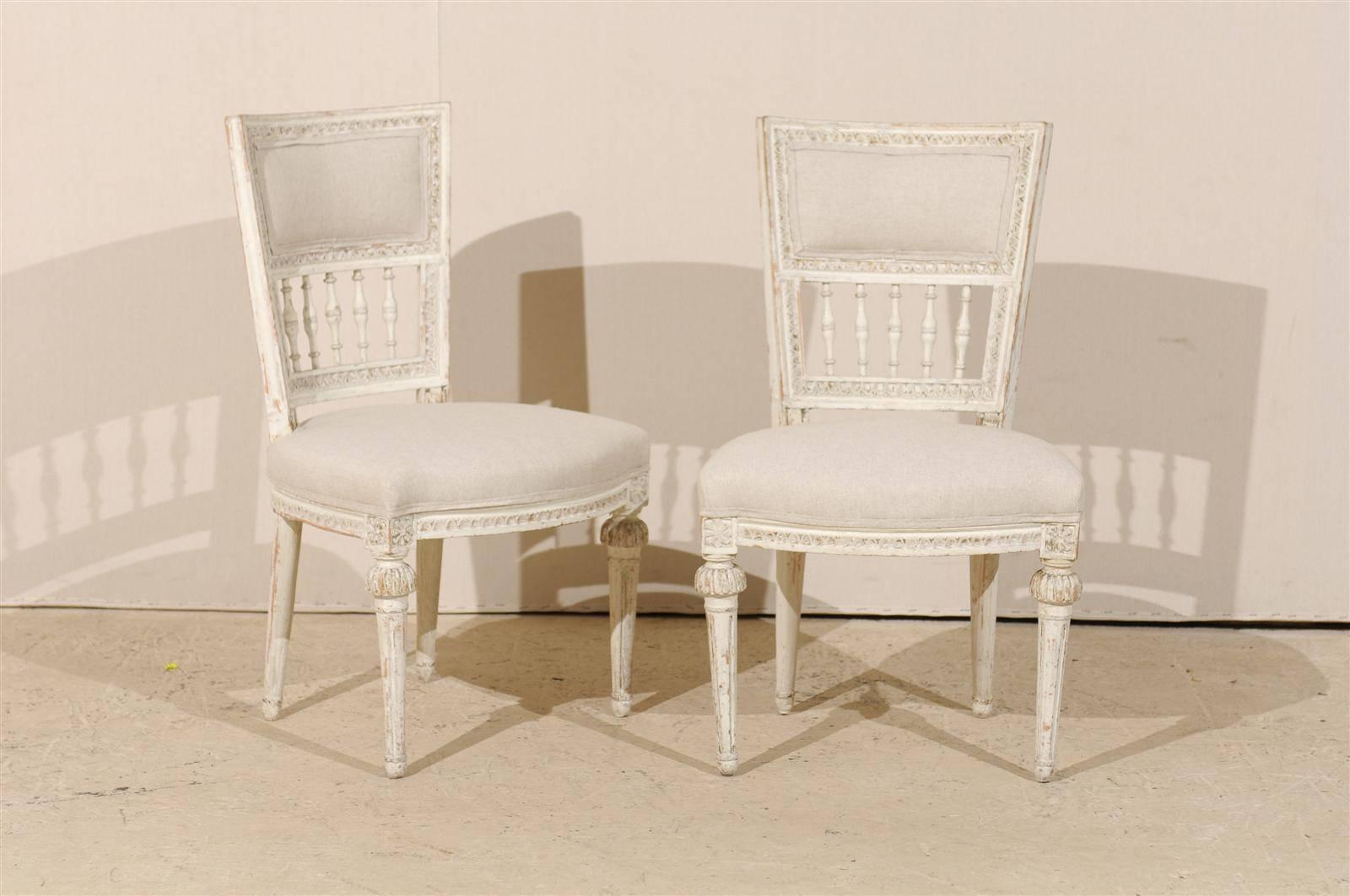 A pair of Swedish late 18th century period Gustavian painted wood side chairs. Signed 