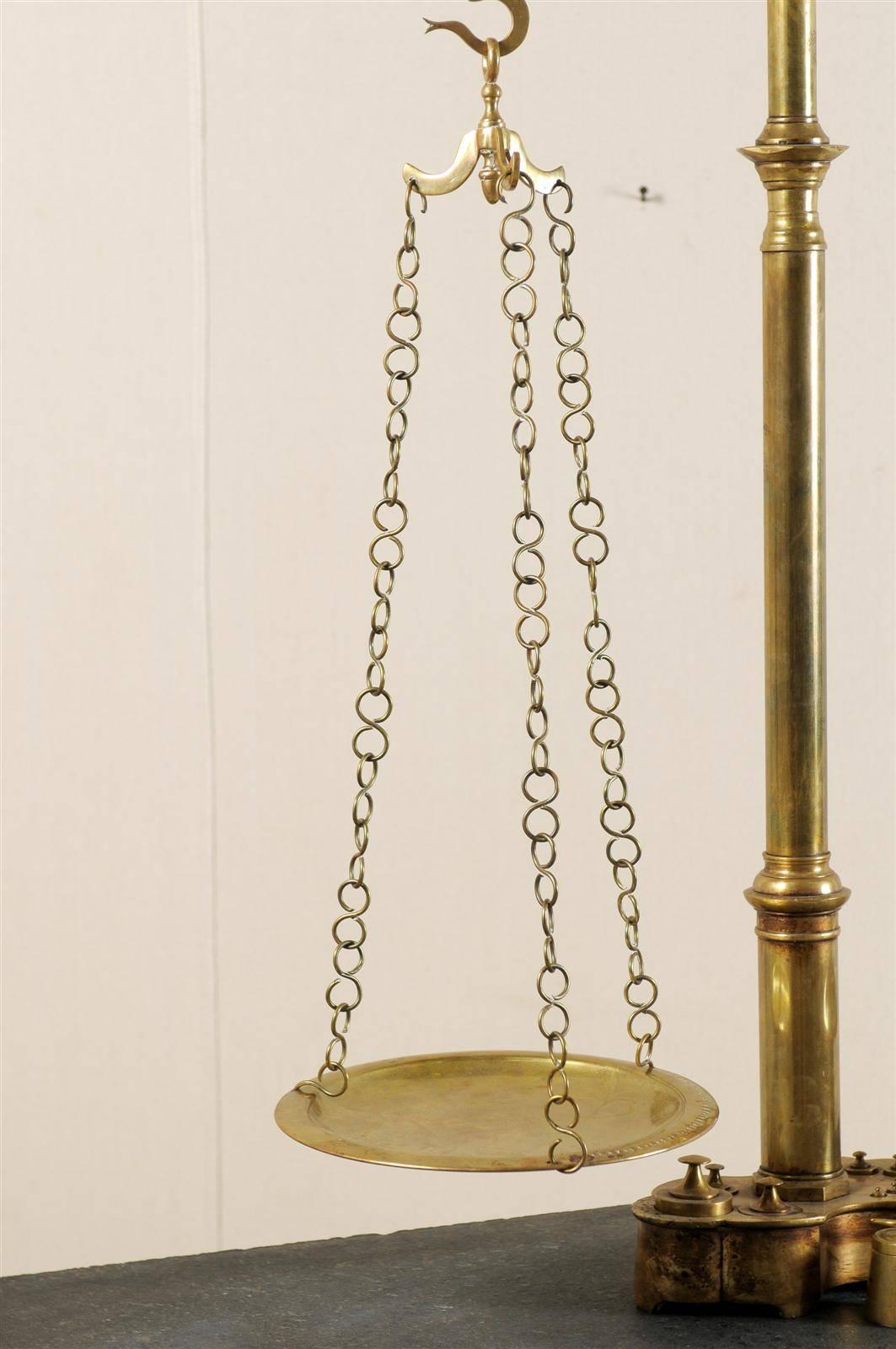 A Grand Sized 19th Century Dutch Brass Scale with Several Small Weights Included In Good Condition In Atlanta, GA