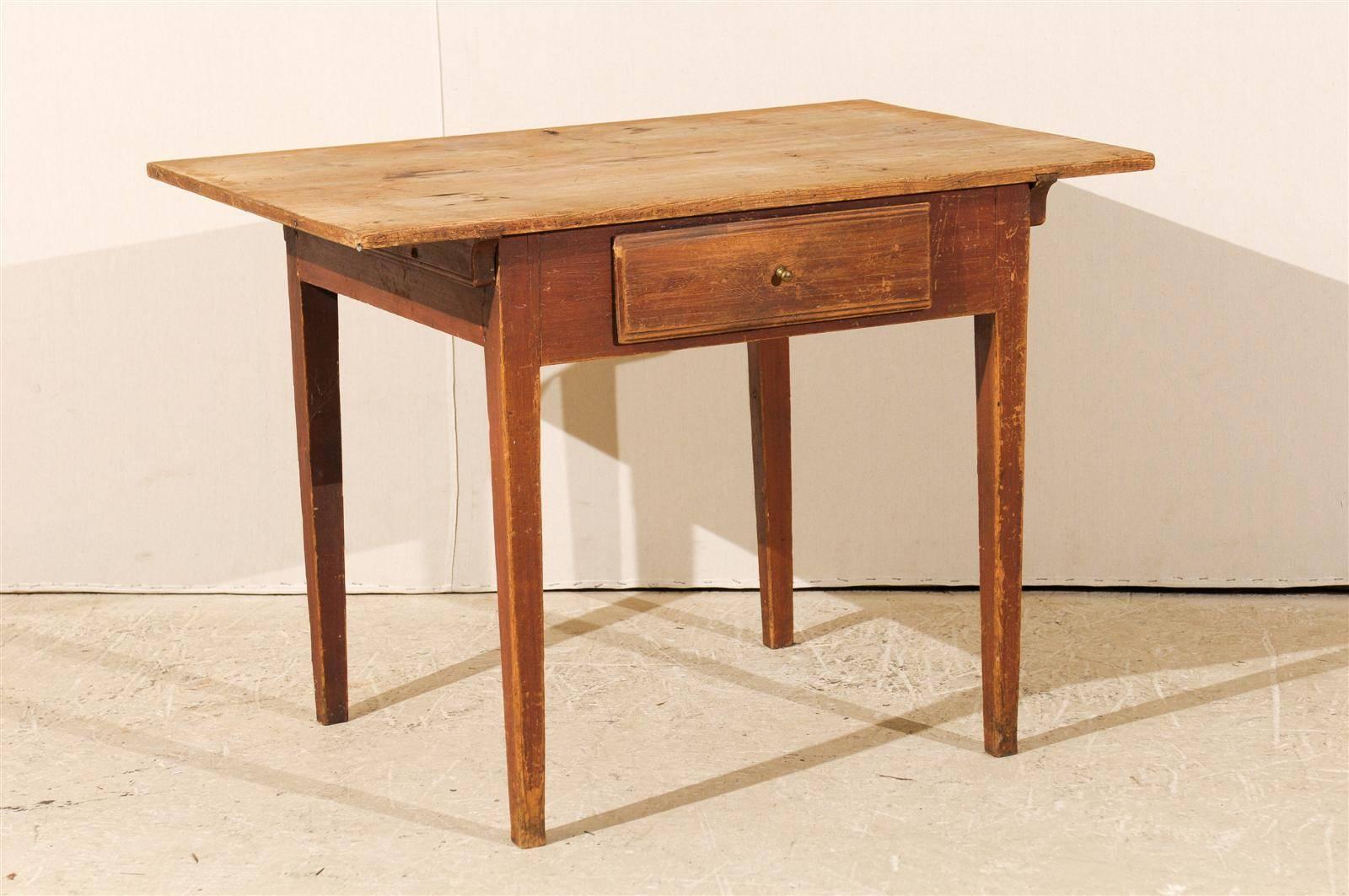 A Swedish mid-19th century single-drawer table. This side table features original finish with beautiful patina showing age. This table has a simple yet elegant structure, with legs that have a slight taper. This Swedish piece would work perfectly as