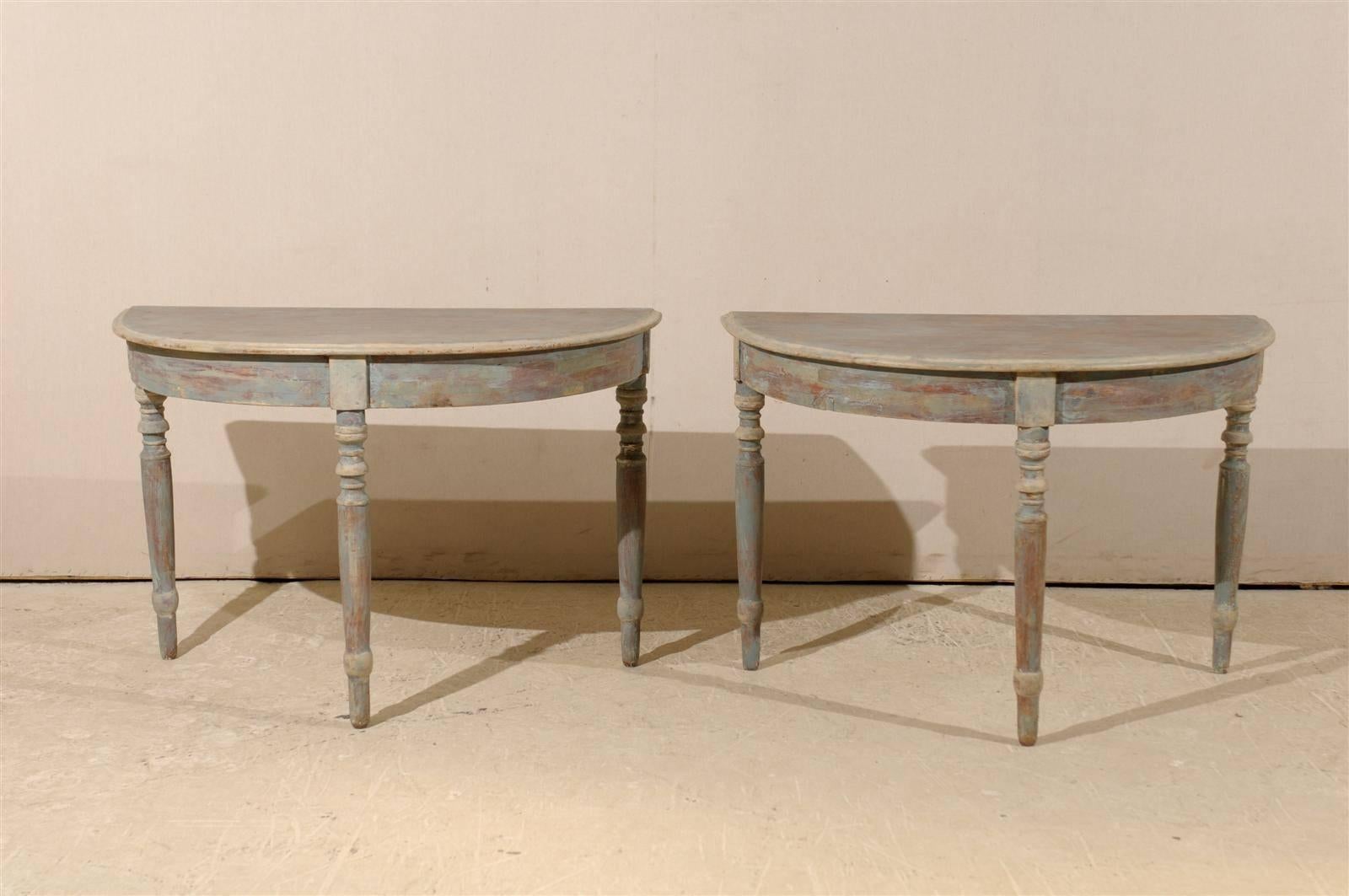 A pair of Swedish 19th century painted wood demilune tables with turned legs and light blue/grey finish with some wood coming through. Put together, the demilunes form a round table.