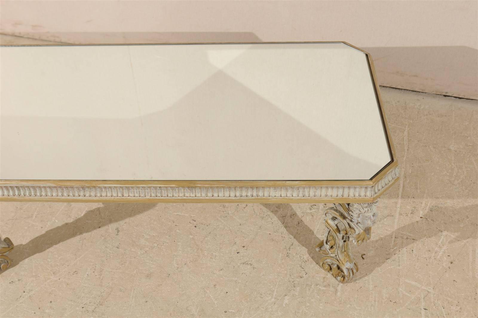 Italian Mirrored Top Coffee Table with Ornate Putti Carved Legs, Circa 1920s In Good Condition For Sale In Atlanta, GA