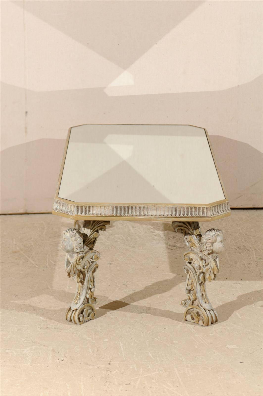 Wood Italian Mirrored Top Coffee Table with Ornate Putti Carved Legs, Circa 1920s For Sale