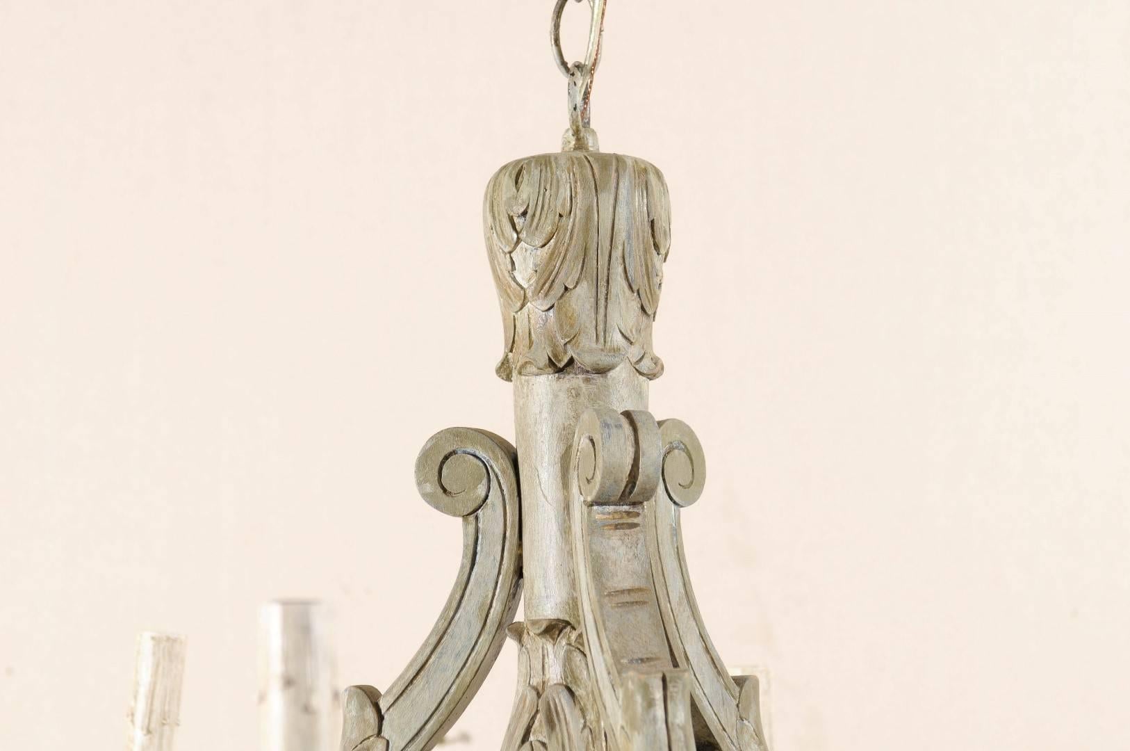 20th Century French Vintage Six-Light Wood Chandelier with Ornate Carvings and Scroll Arms